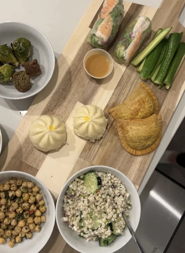 fresh tofu and shrimp spring rolls. roasted garlic chickpea salad. puffed couscous salad with a zataar feta dressing.