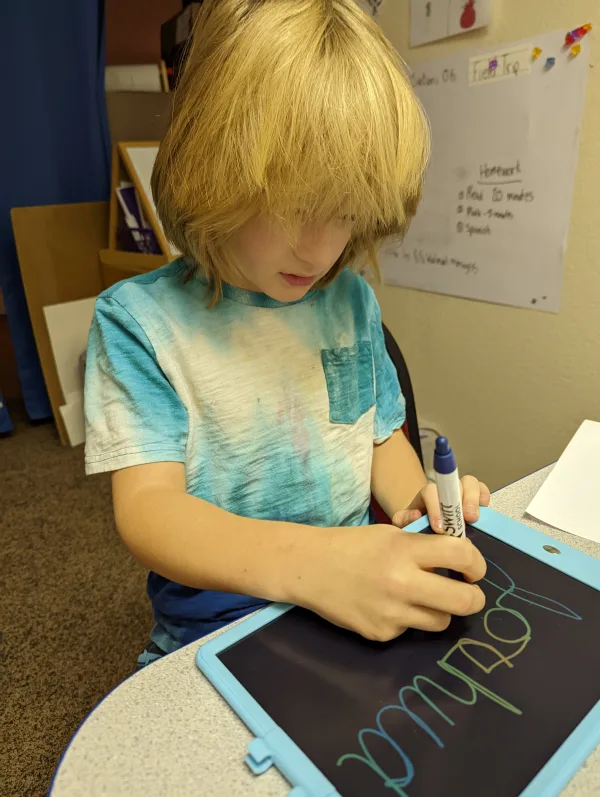 Student working on cursive