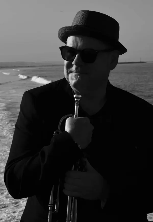 Trying hard not to drop my trumpet into the Pacific Ocean.