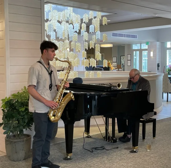 Sax student sitting in on job