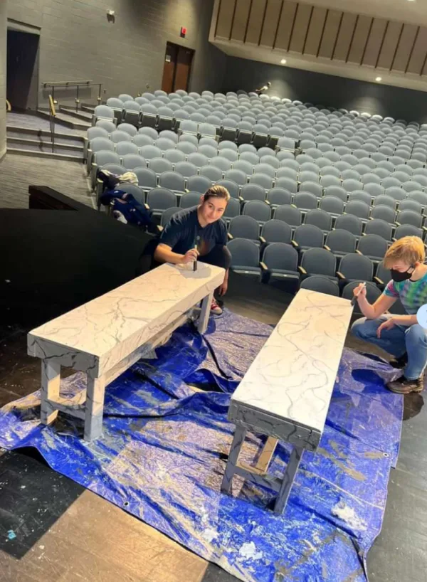 Painting marbled benches for ‘A Christmas Carol’