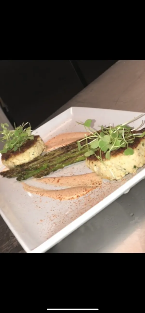 Golden crab cakes with asparagus