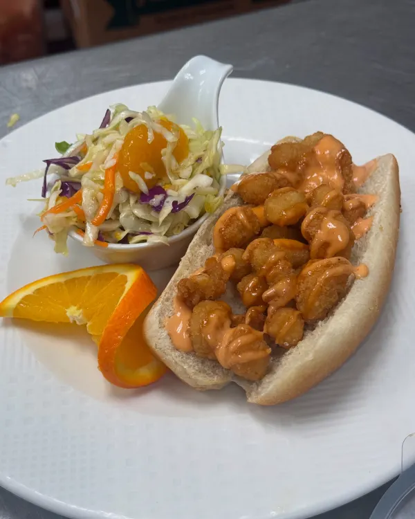 Shrimp Po boy complemented with orange coleslaw 🍊