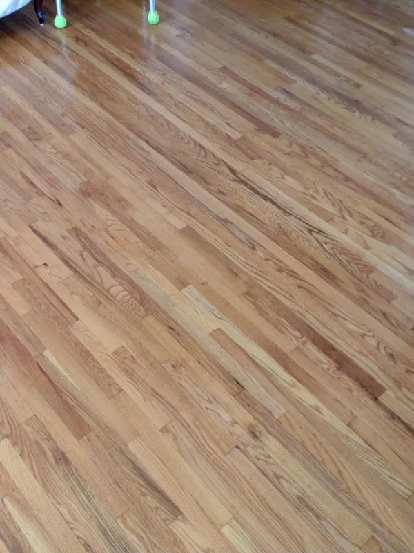Resurfaced, sealed and polished this hardwood floor