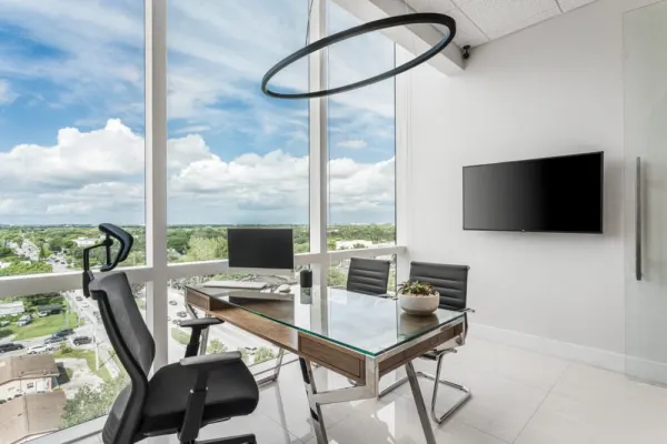 Our office, featuring a bright, modern design with large windows and a comfortable, professional atmosphere