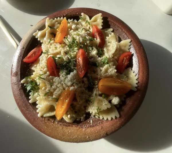 butternut squash pasta with cherry tomatoes and parmesan.