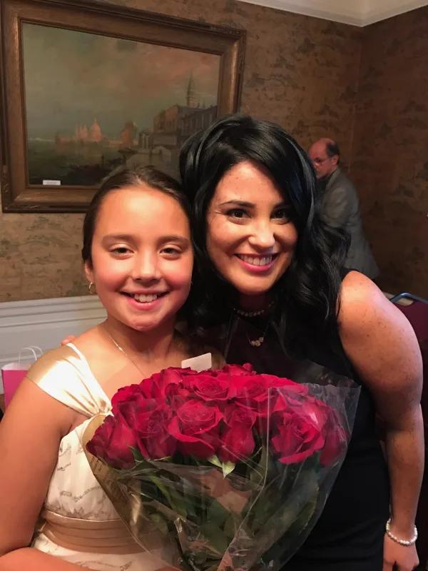 With student after voice recital 