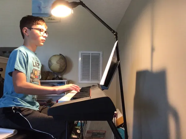 Teenage piano student