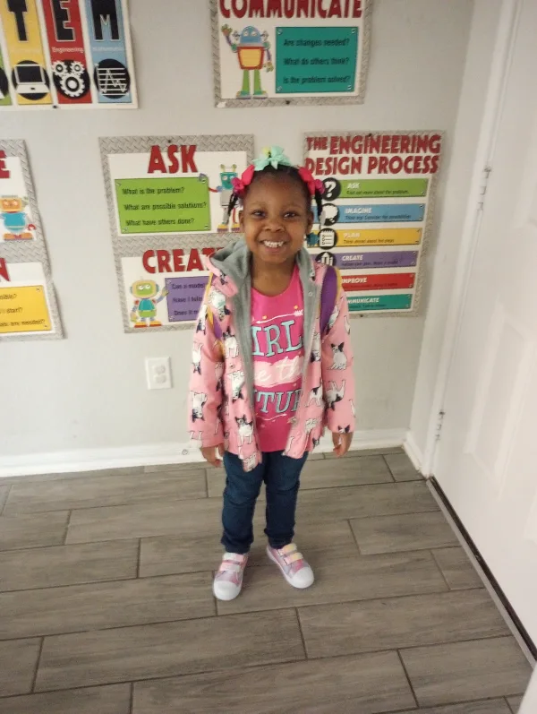 Happy kiddo leaving for school .