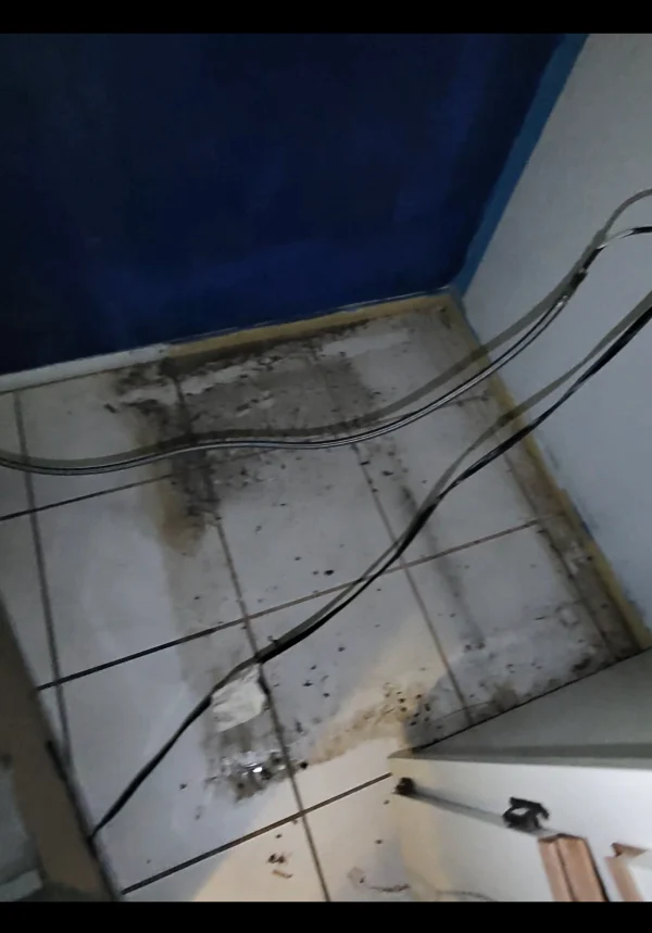 Behind Refrigerator Before