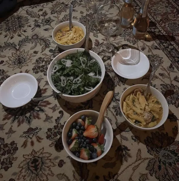 spicy sausage butter pasta with a rustic tomato sauce along with a shallot kale salad and fruit salad.