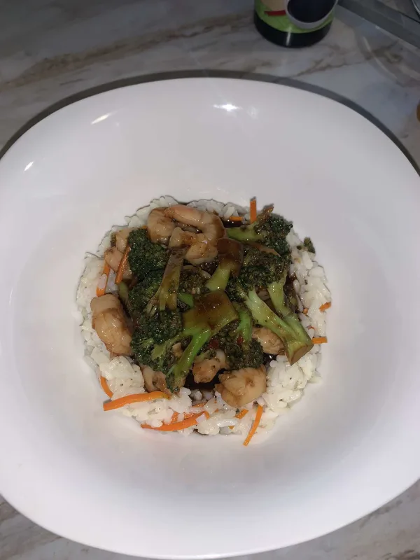 Shrimp and veggies on a bed of rice