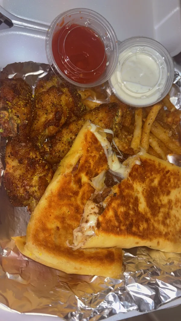 Oxtail wrap with fries and lemon pepper wings