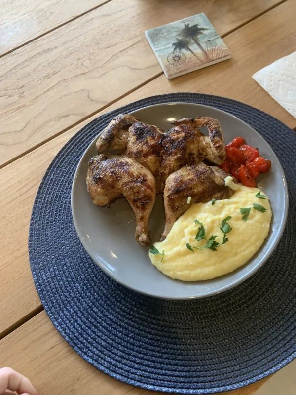 Roasted chicken, polenta, pan seared cherry tomatoes