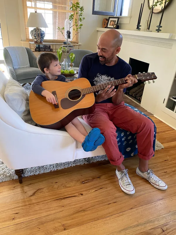 That guitar may be a little big but he's getting it