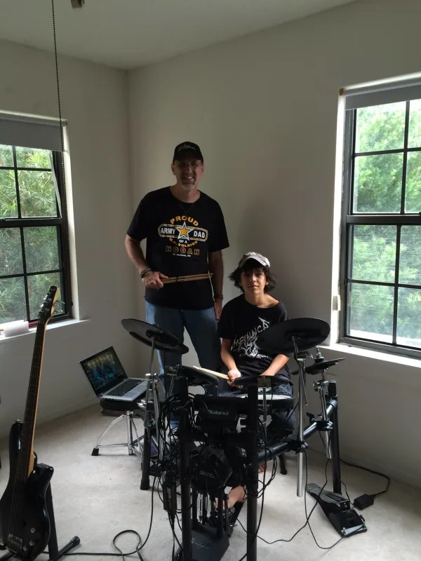 Teaching a young student some new grooves.