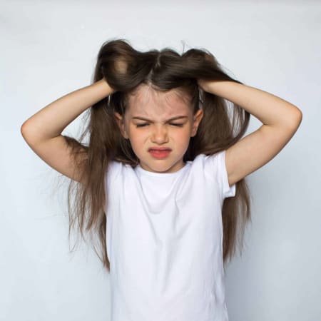 young-girl-itching-head-from-lice