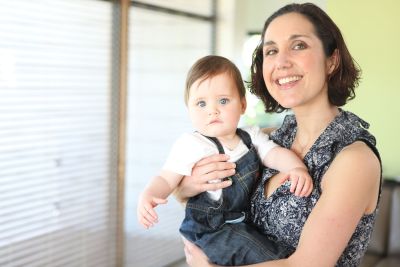 A mom holding her baby. 