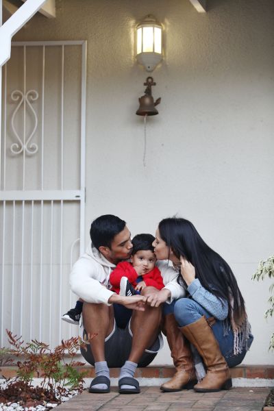 A beautiful family at their front door during the lock down.