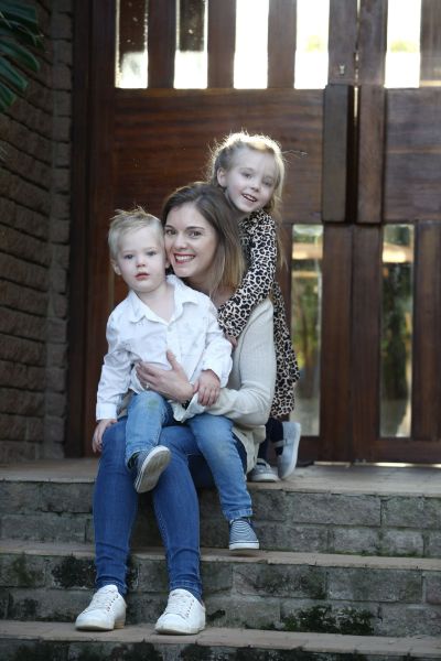 Mom and her children at their front door. 