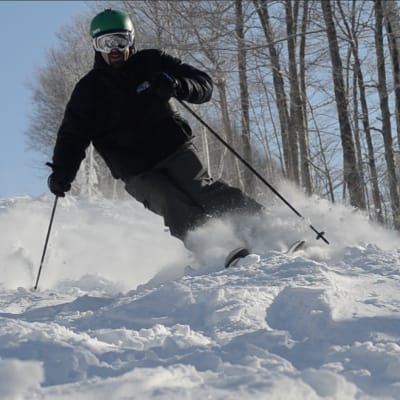 Enjoying some powder under the Winslow Quad Chairliftt