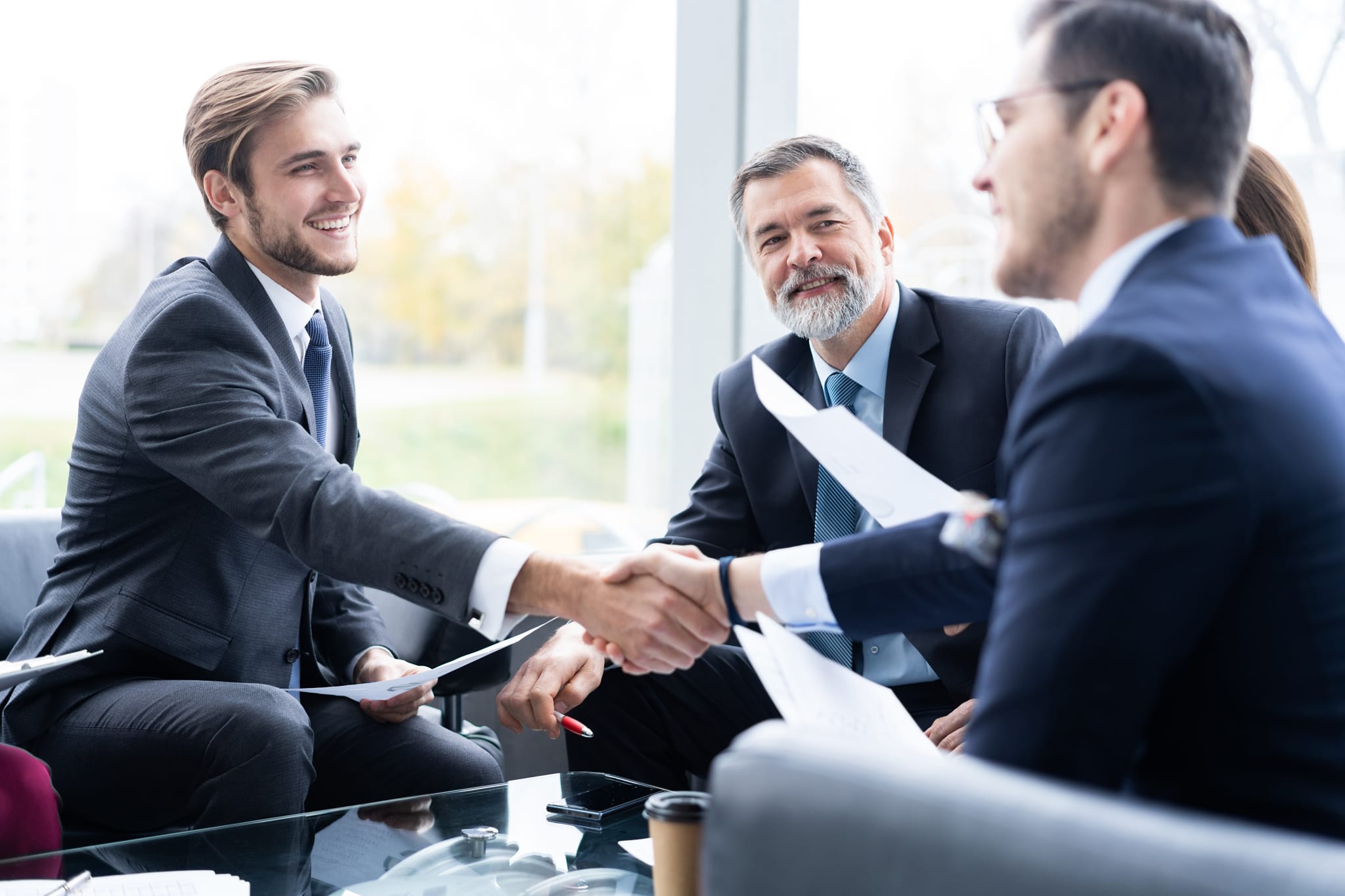 Business people shaking hands, finishing up a meeting. Handshake. Business concept. Business people shaking hands, finishing up a meeting. Handshake. Business concept