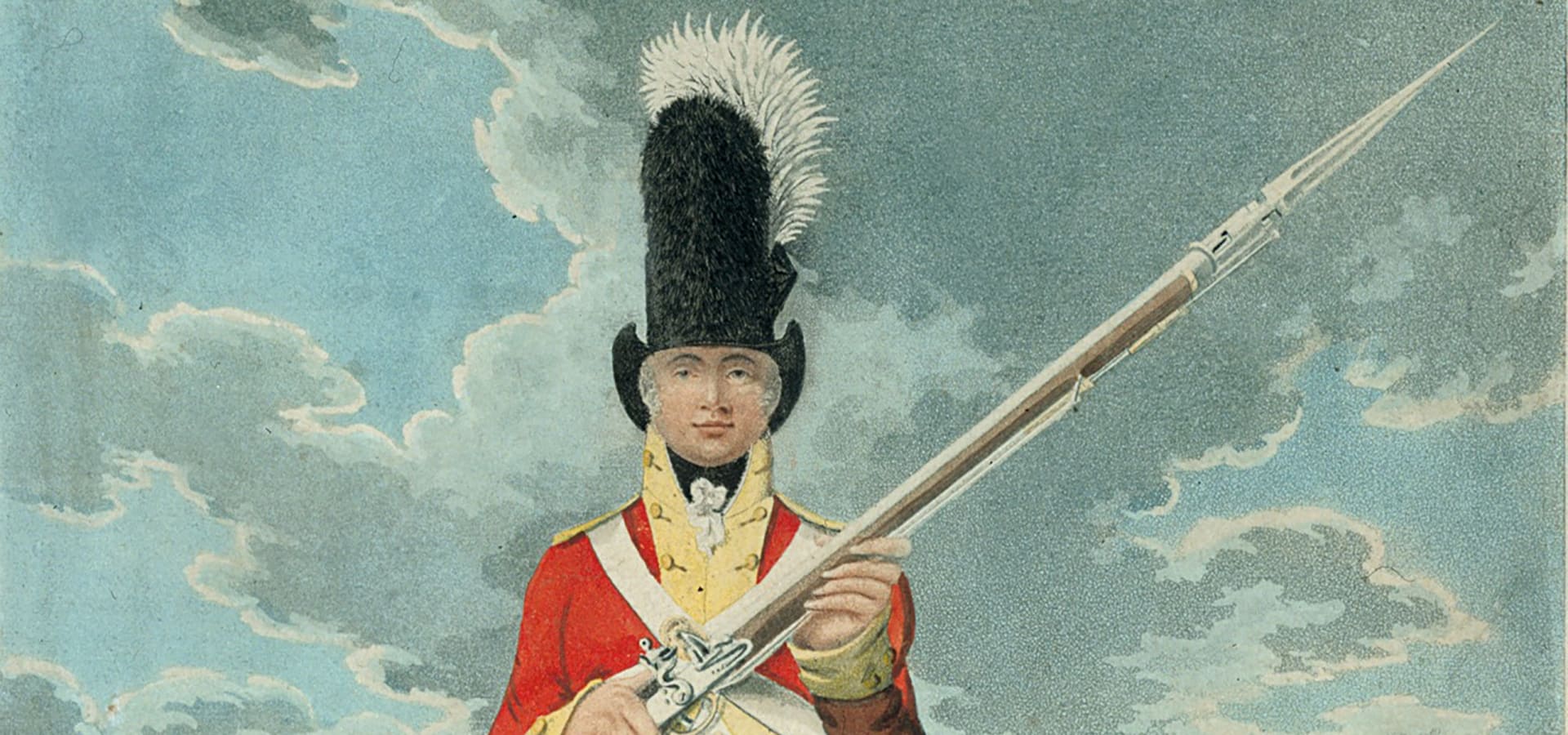 British soldier in red coat and tall bearskin hat holding a musket during a military parade in a historic courtyard.