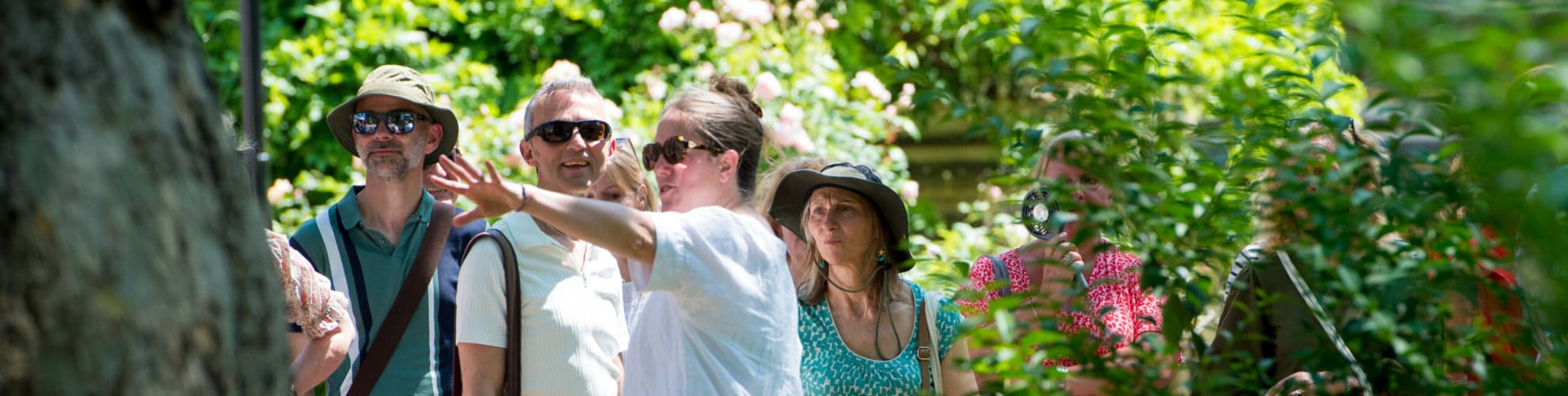 The Inn's Head Gardener pointing out features on to a gardens tour group