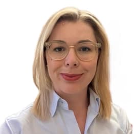Laura Gould smiling in front of white background