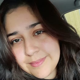 Extreme close-up of a smiling Zainab Tariq.