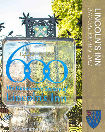 Vertical gold banner reads 