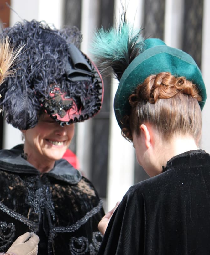 3 women in period dress on a break from filming Sherlock