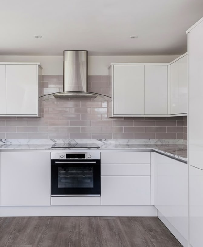 Modern kitchen with grey marbled counter tops.