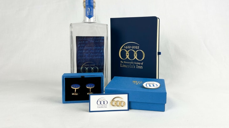 A group of products from the Inn's 600th Anniversary range (gin, cufflinks, lapel pin, notepad, brooch.