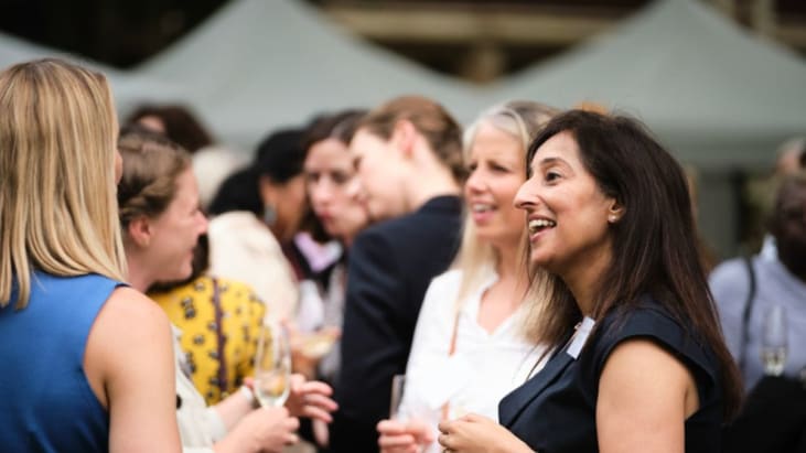 People chat at ICAW garden party