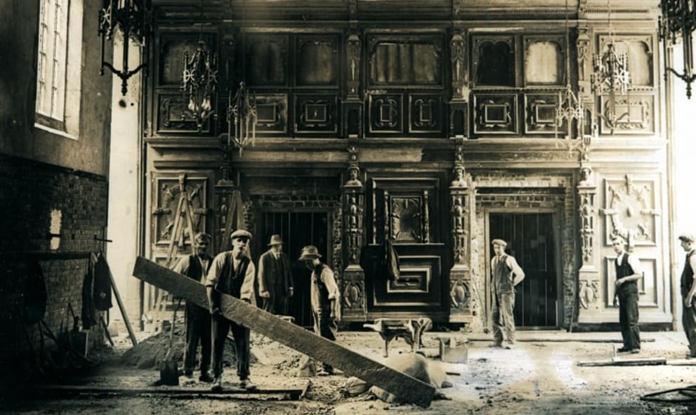 Black and white photo of construction of historic hall