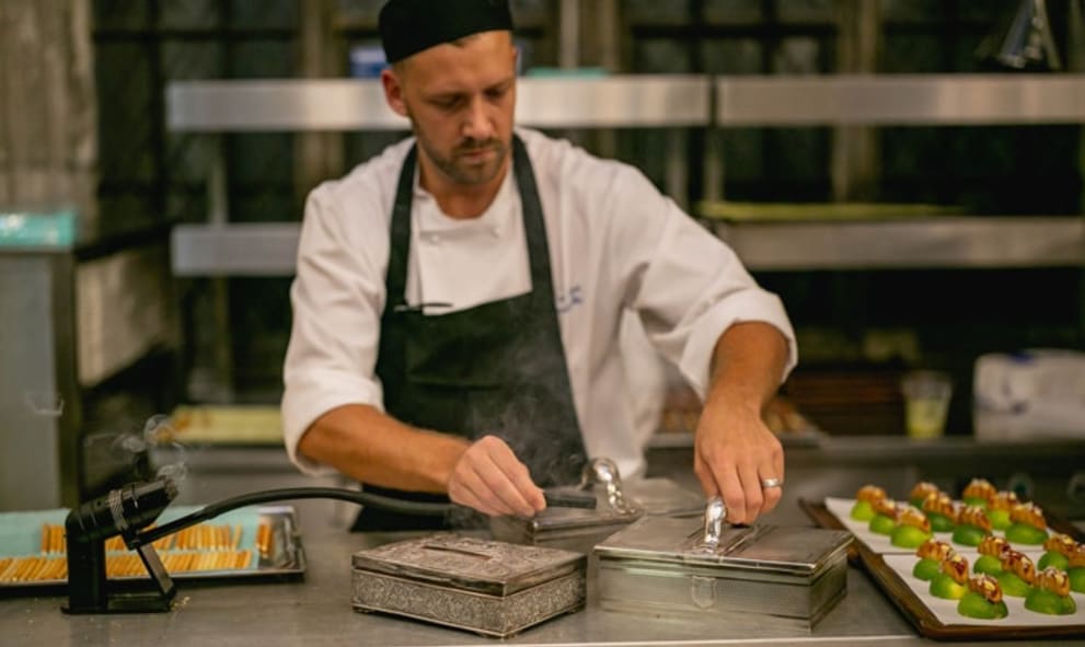 Chef preparing dishes in kitchen