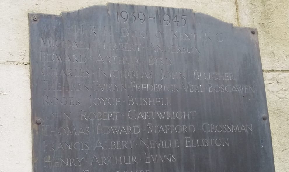 Photograph of WWII memorial at Lincoln's Inn, a grey slab commemorating the names of fallen soldiers