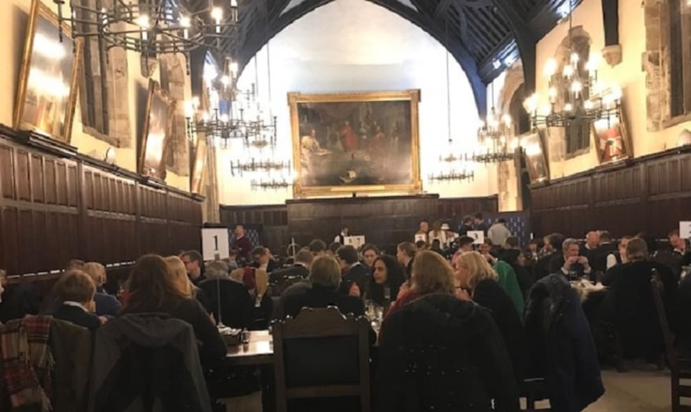 quiz teams at numbered tables in the Old Hall