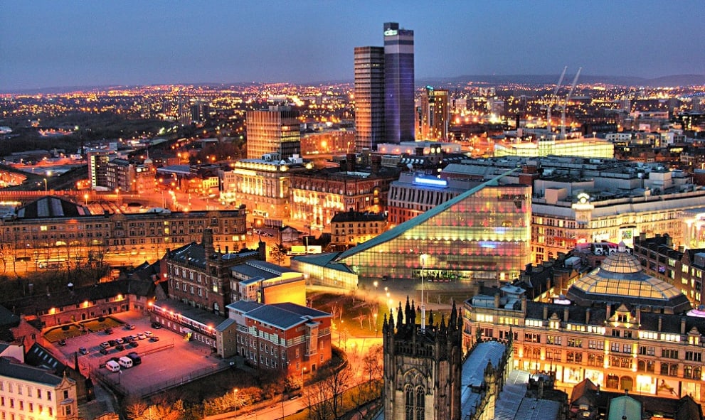 Manchester, EnglanManchester city center skyline at night showing various buildings and streets