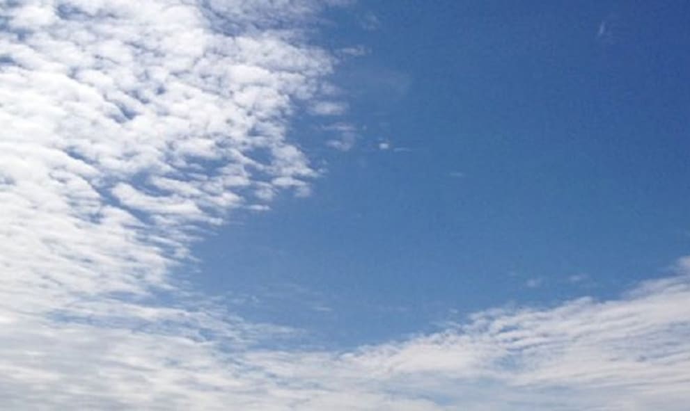 Blue sky striated with clouds.