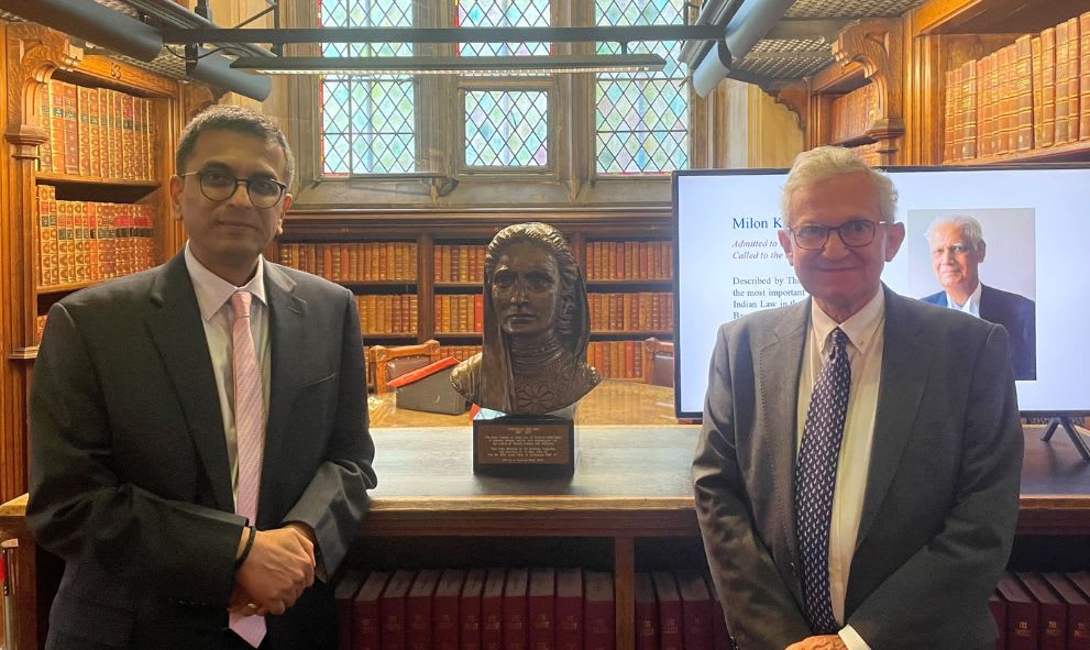 Chief Justice Chandrachud stands with the Treasurer next to the bust of Cornelia Sorabji in the Library of Lincoln's Inn.