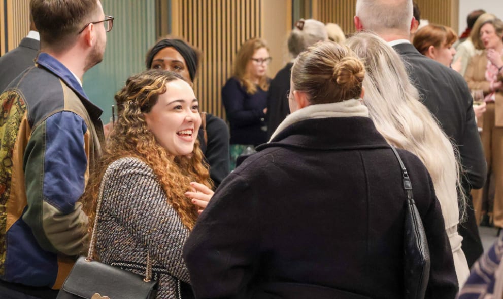 Attendees chatting post-Harman lecture in the Ashworth