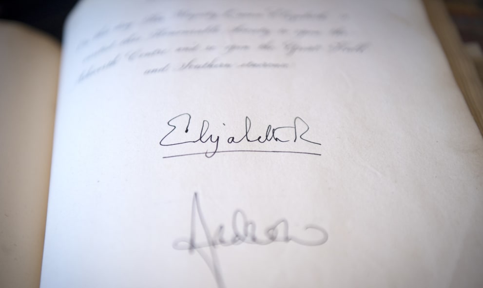 Page with signature of Queen Elizabeth for the official reopening of Great Hall
