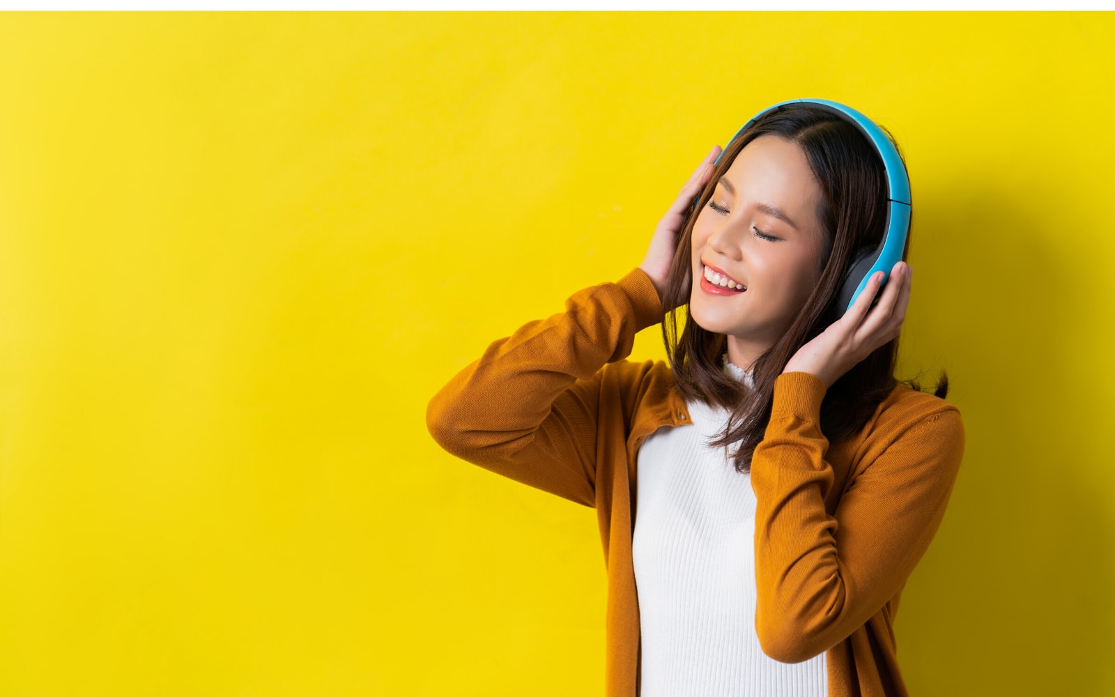 Woman listening and repeating what she hears while learning an accent.