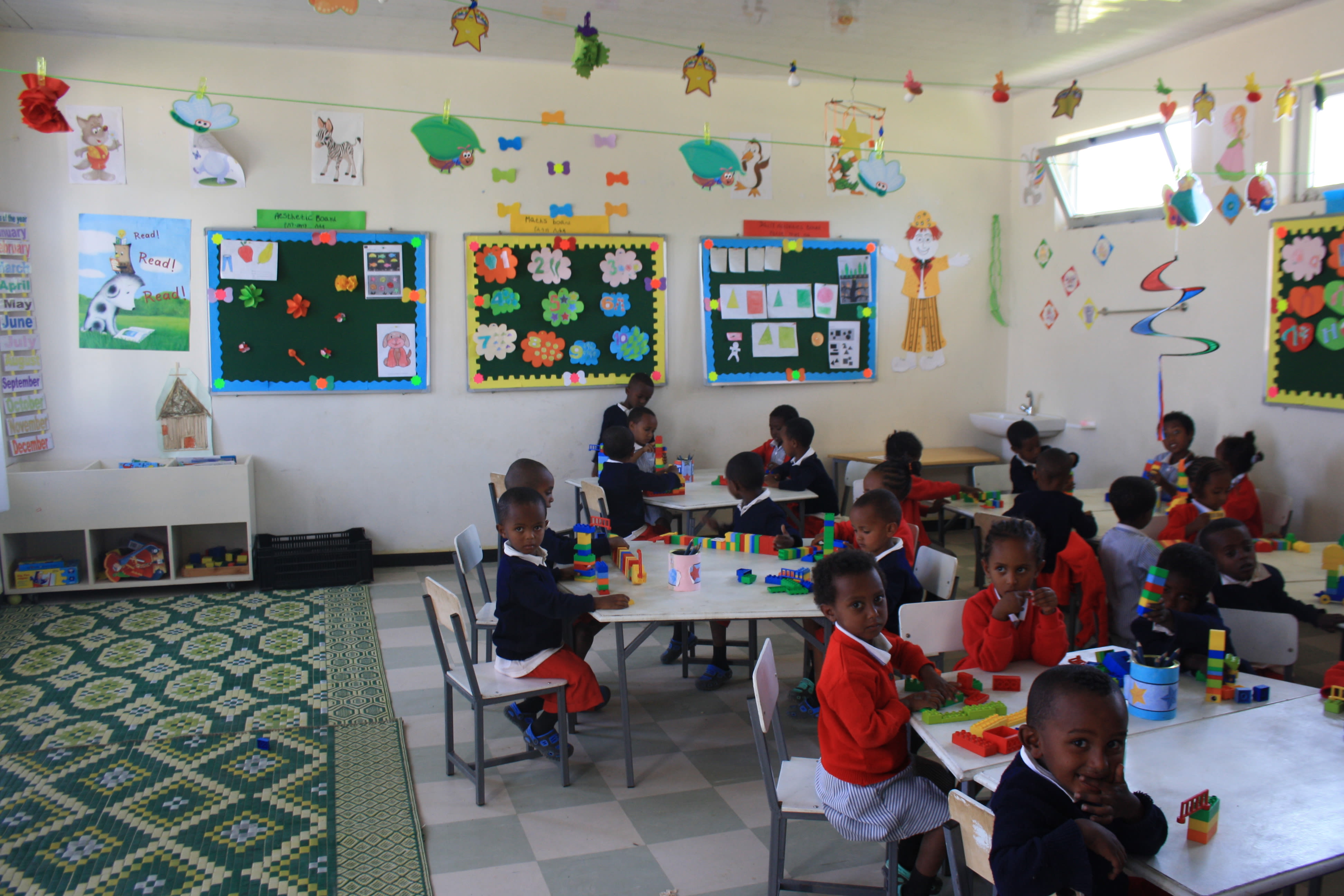One of the first classes at the new St. George’s School enjoys learning in this colourful and stimulating environment.