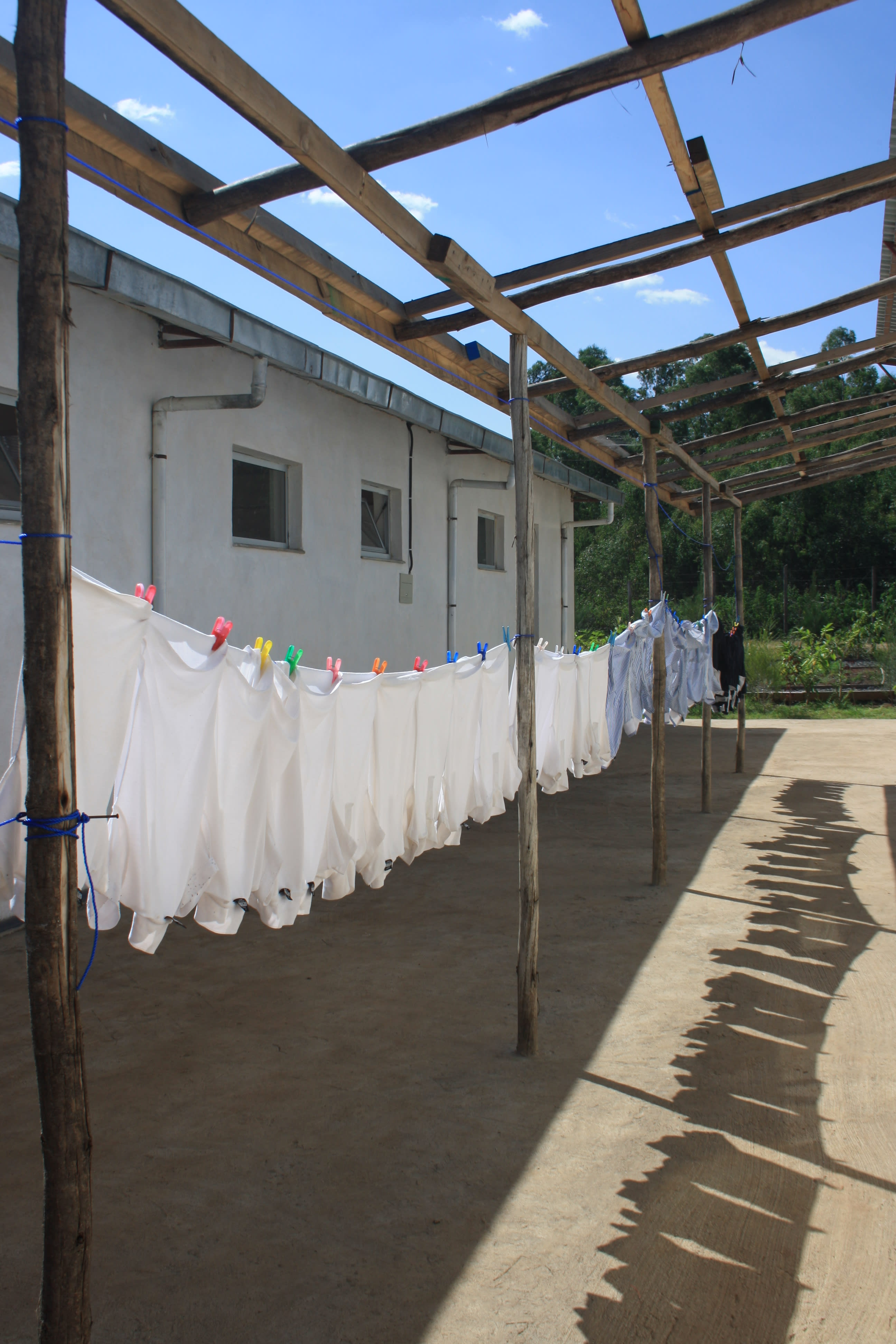 School uniforms hanging out to dry at St. George’s. The school provides uniforms and materials as priority is given to orphans and children from poor families.