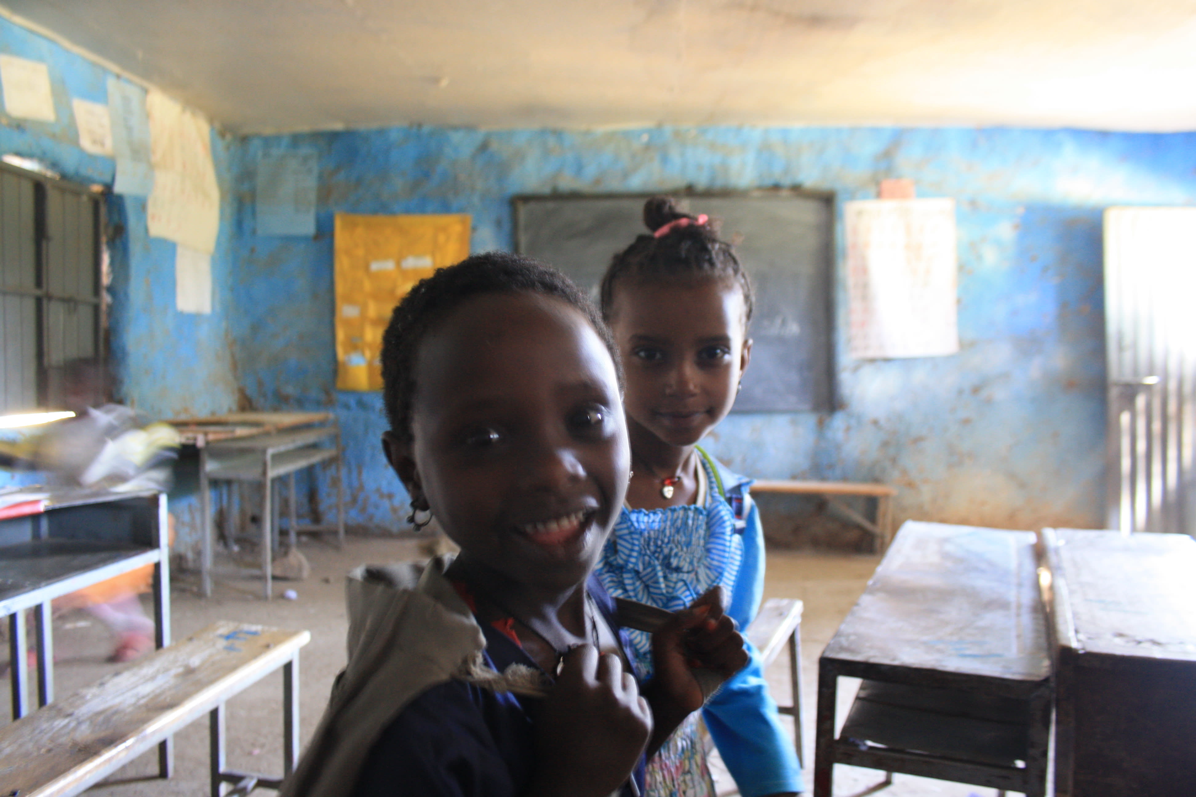 Grade 1 and 2 students taking our reading test and posing for the camera at Arbatu Ensesa school on the outskirts of Gondar.