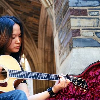 Neah Lee - Playing Guitar on the Steps with Maroon Case - Photography