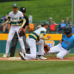 Caribbean player sliding into second